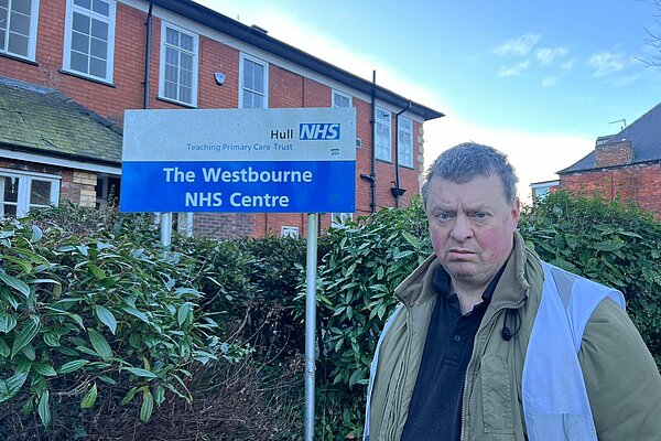 Cllr John Robinson in front of the Westbourne NHS Centre